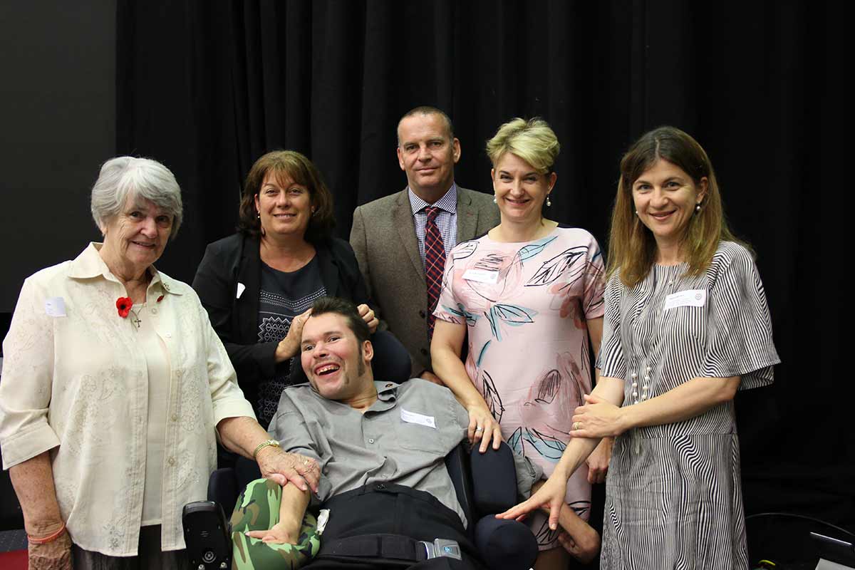 Youngcare Wesley Mission Brisbane resident Ryan Douglass with his Mum, Barbara and Grandmother, Deborah, Youngcare Connect Manager Shane Jamieson, Youngcare CEO Samantha Kennerley and Operations Manager Melissa Morrison at the National Injury Insurance Scheme launch in Queensland.