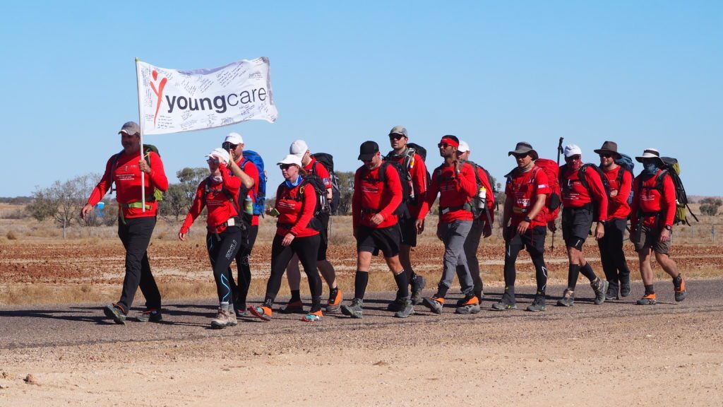 SDC trekkers holding the Youngcare flag