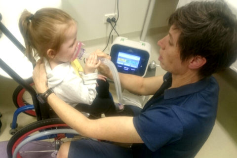 Alexis in hospital using a cough assist machine